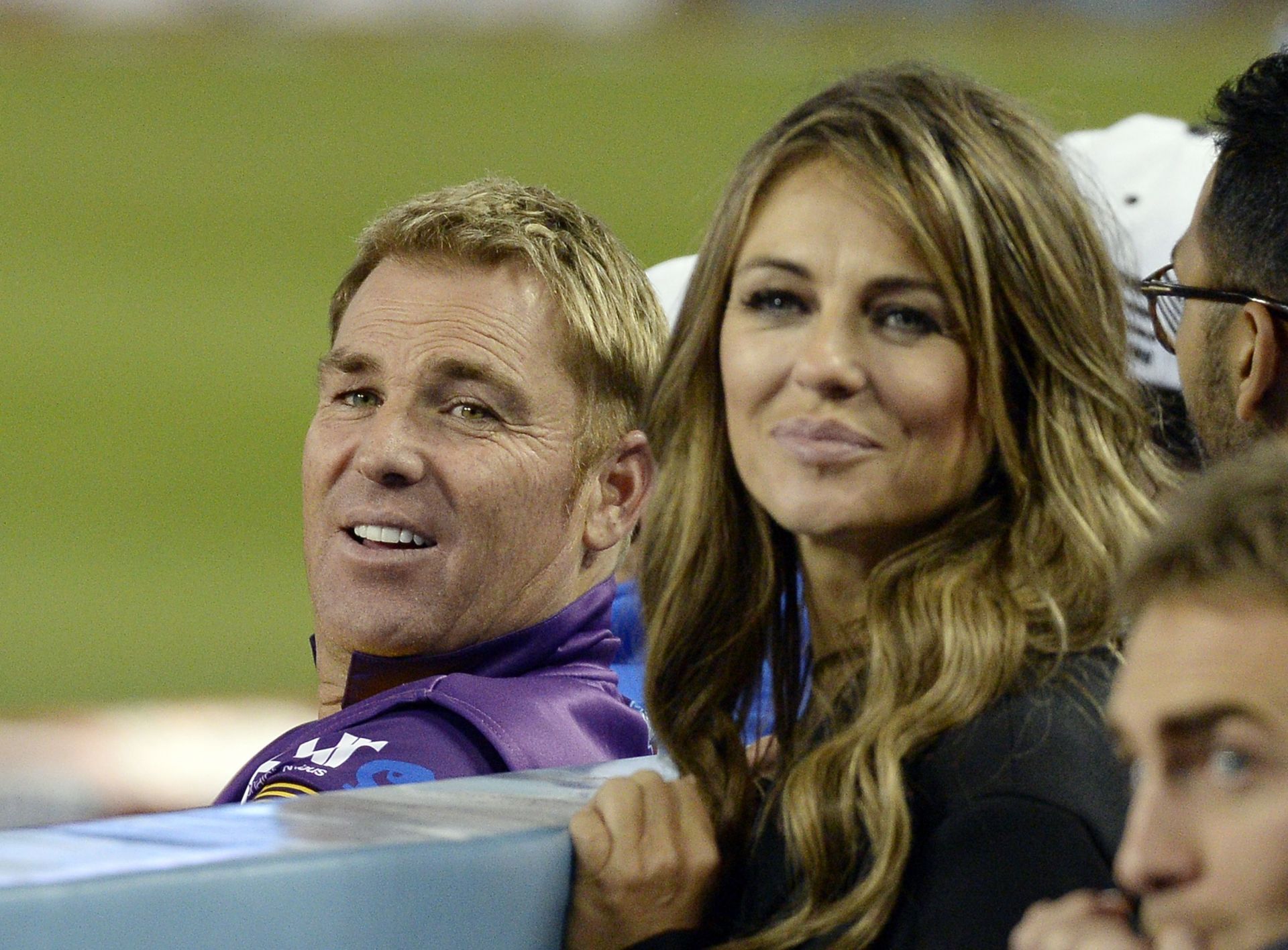 Elizabeth Hurley (right) poses with Shane Warne. Pic: Getty Images