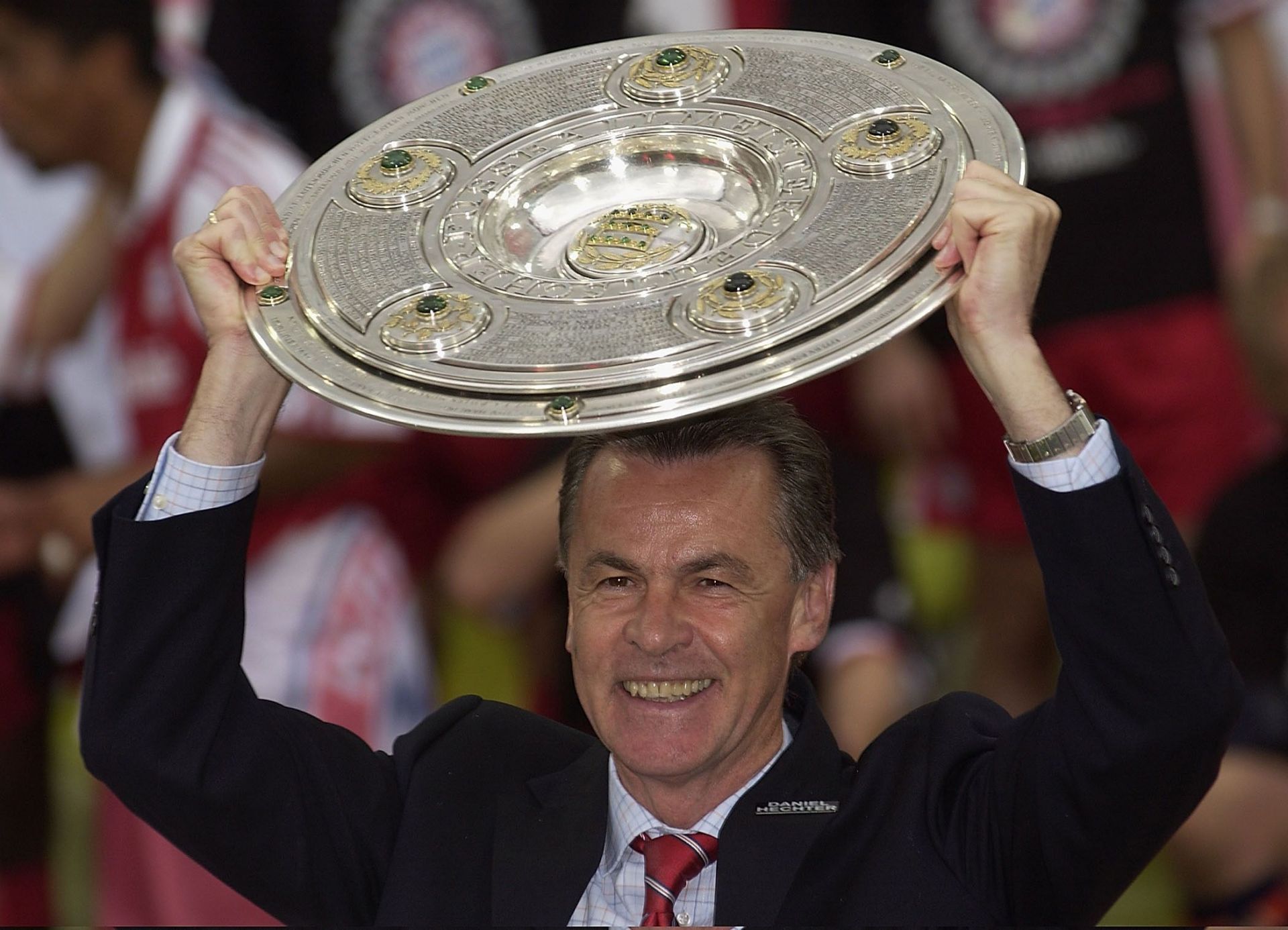 Coach Ottmar Hitzfeld of Bayern with the trophy