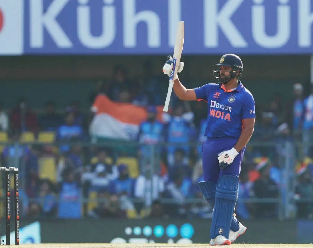 Rohit Sharma raising his batter after a half-century in Guwahati [Pic Credit: BCCI]