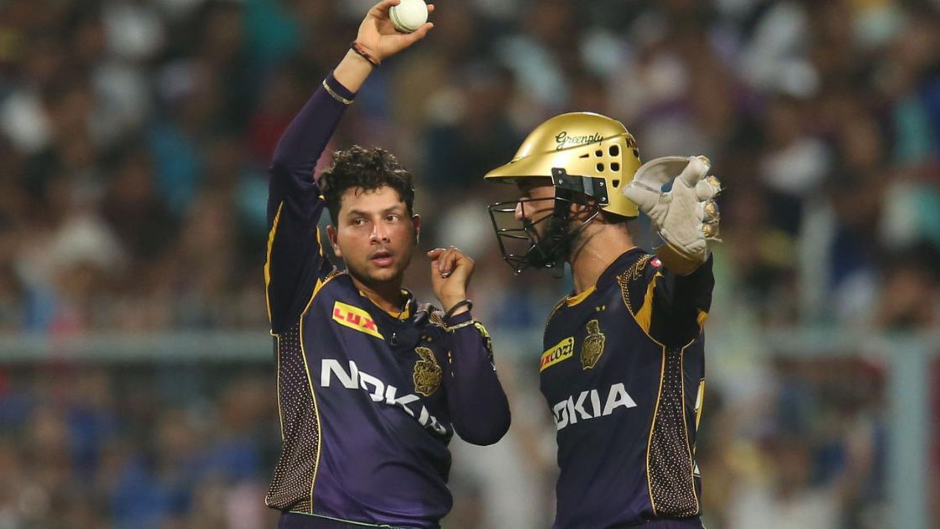 Kuldeep Yadav (L) and Dinesh Karthik in action for KKR (P.C.:iplt20.com)