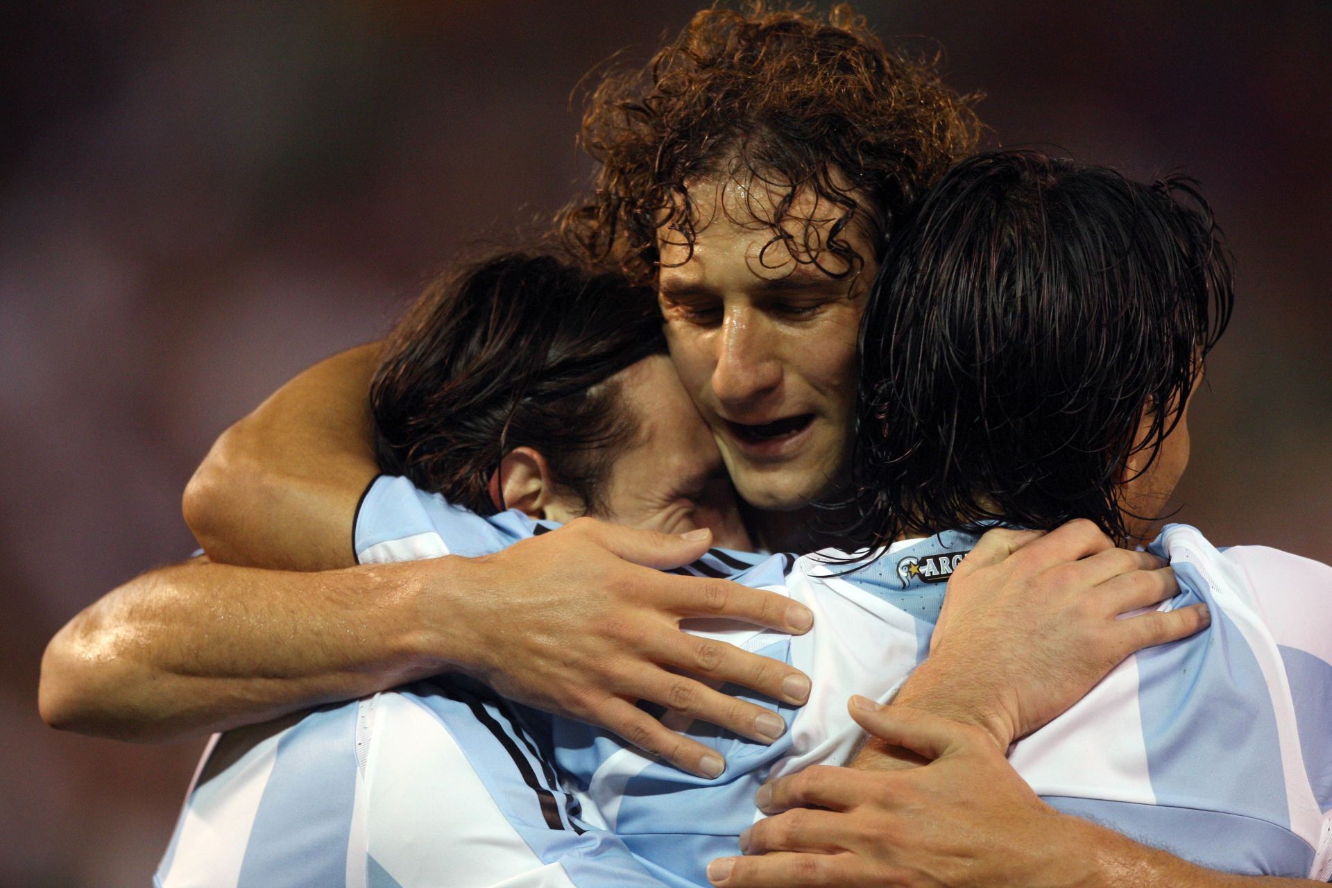 Lionel Messi embraces Fabricio Coloccini after scoring for Argentina
