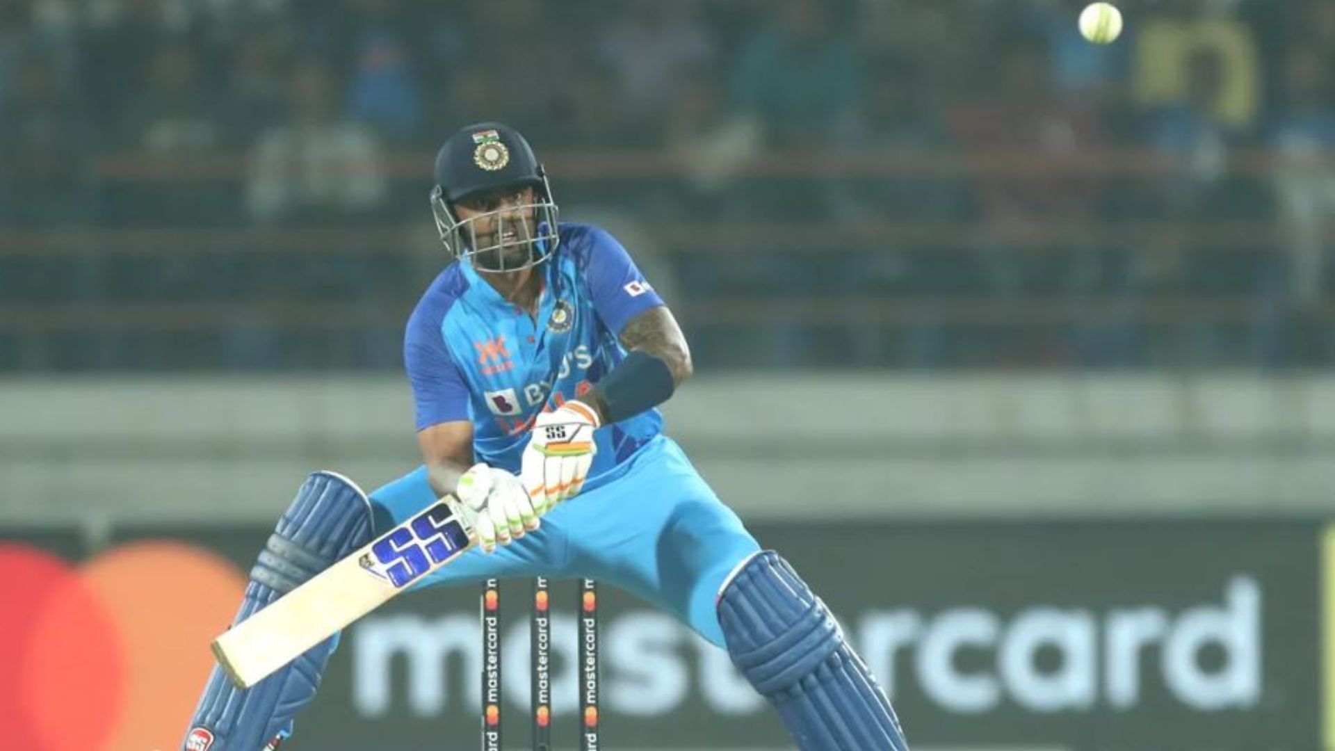 Suryakumar Yadav plays an audacious scoop shot during his century against Sri Lanka. 