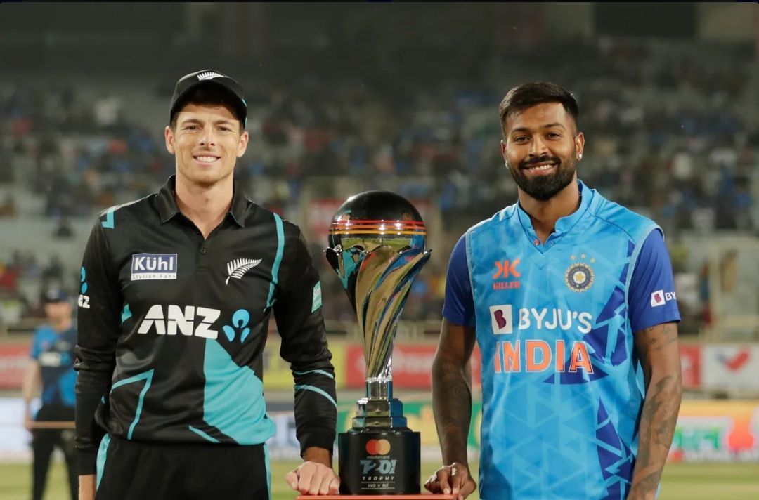 Mitchell Santner (L) and Hardik Pandya (R) posing with the T20I Trophy [Pic Credit: BCCI]