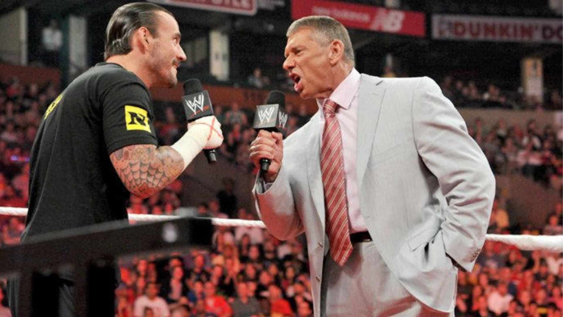 Former WWE superstar CM Punk with Vince McMahon 