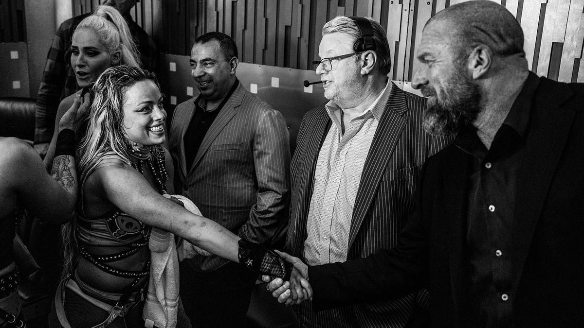 Liv Morgan, Bruce Prichard, and Triple H