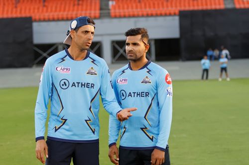 Head coach Ashish Nehra with pacer Shivam Mavi.