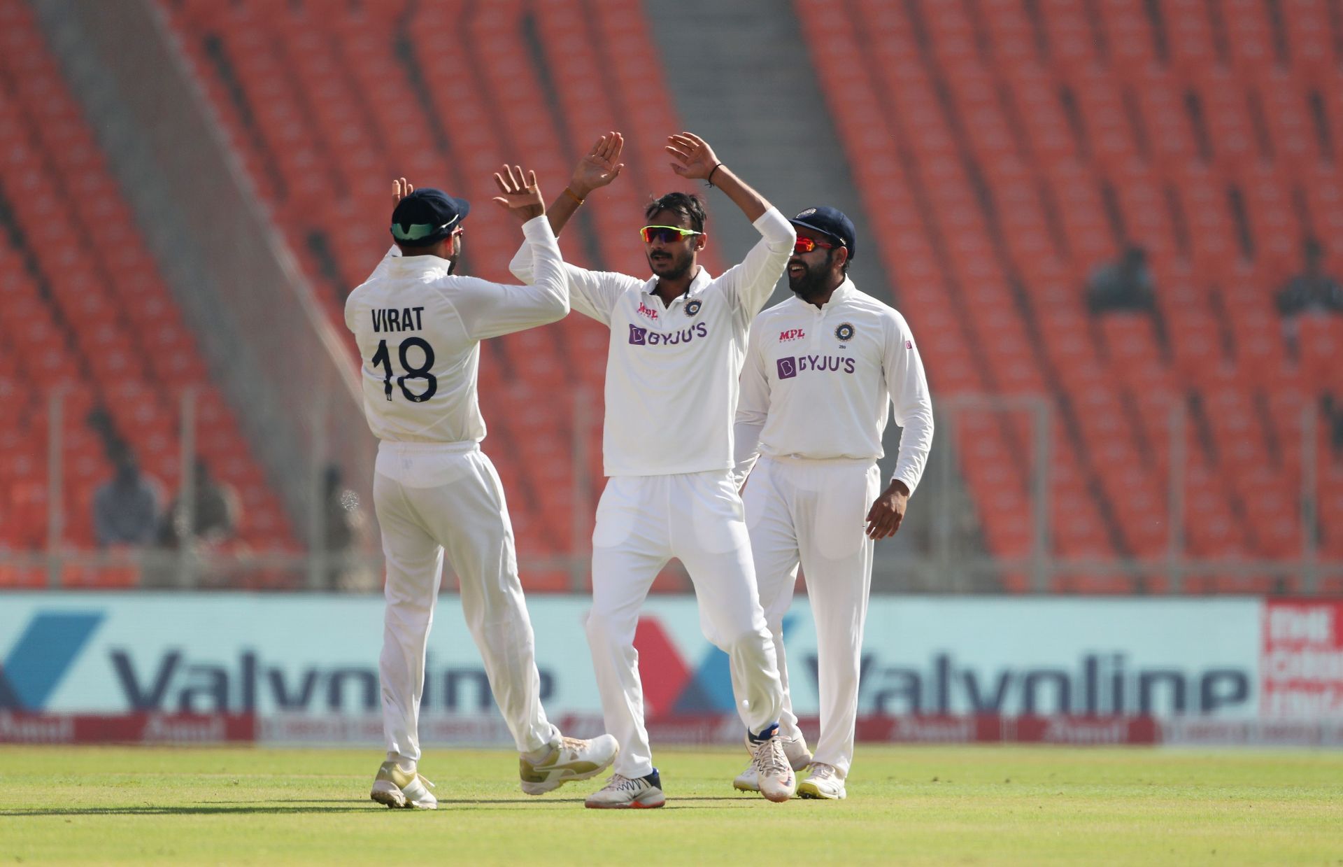 Axar Patel (centre) bowled just 13 overs in the Delhi Test