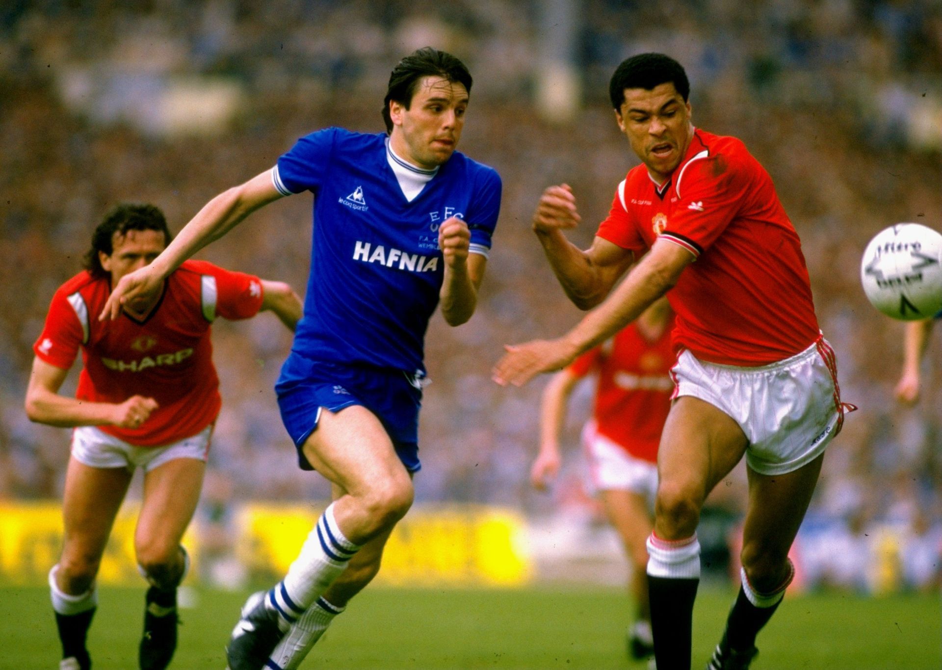 Paul McGrath (R) in action for Man United.