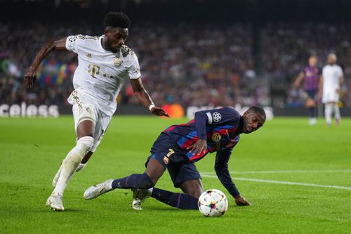 Dembele [R] and Davies in action.