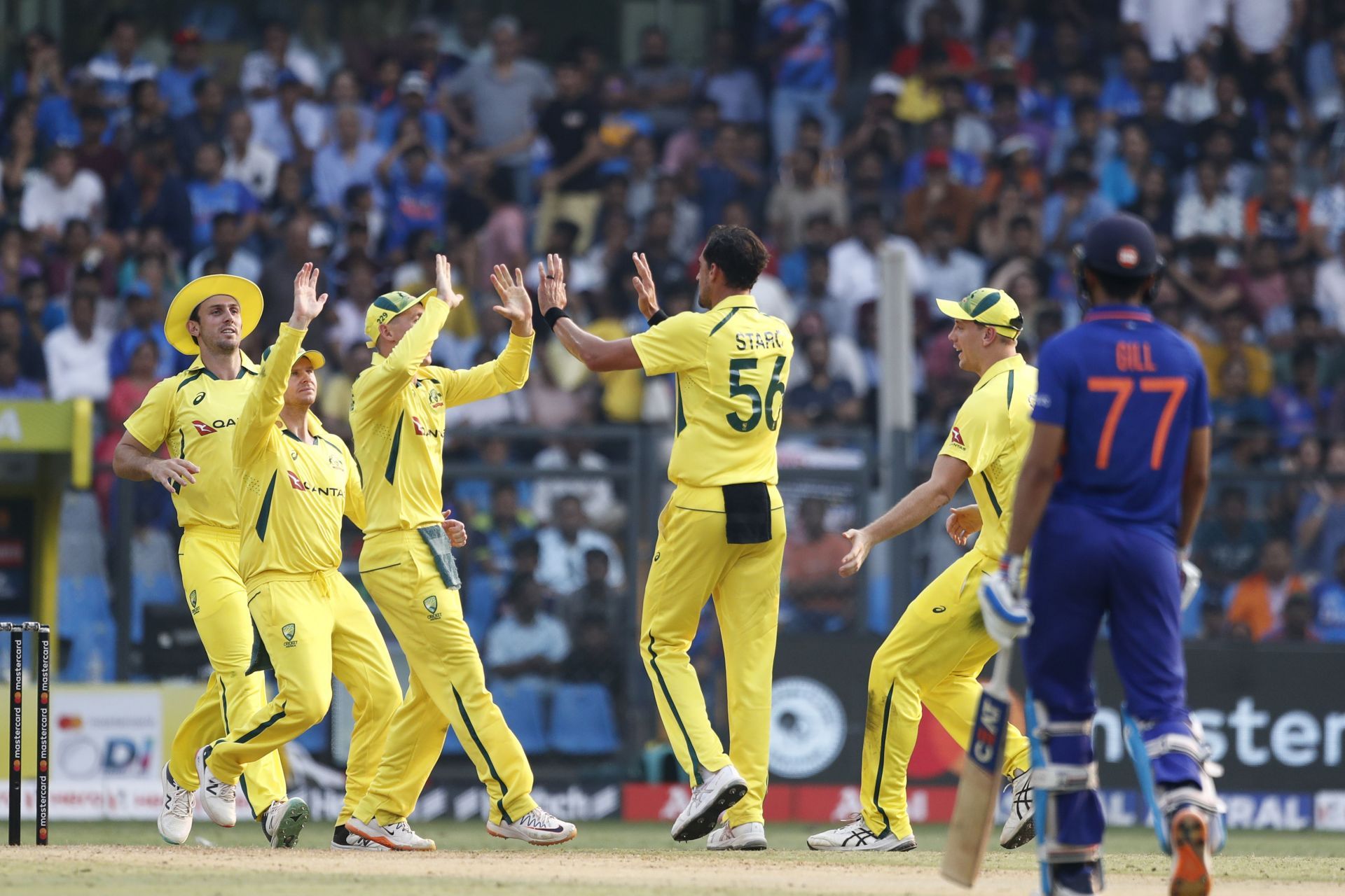 Australia celebrates Virat Kohli's wicket in the first ODI. (Credits: Getty)