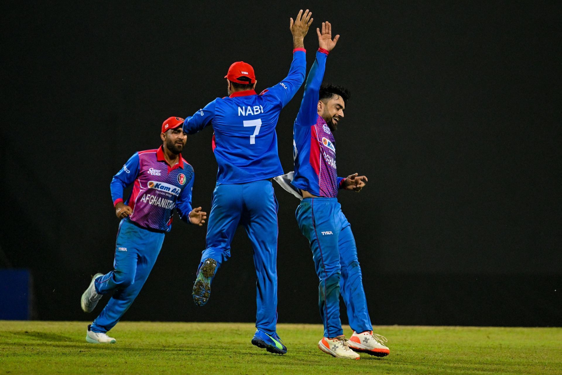 Rashid Khan and Mohammad Nabi celebrate a wicket. (Credits: Twitter)
