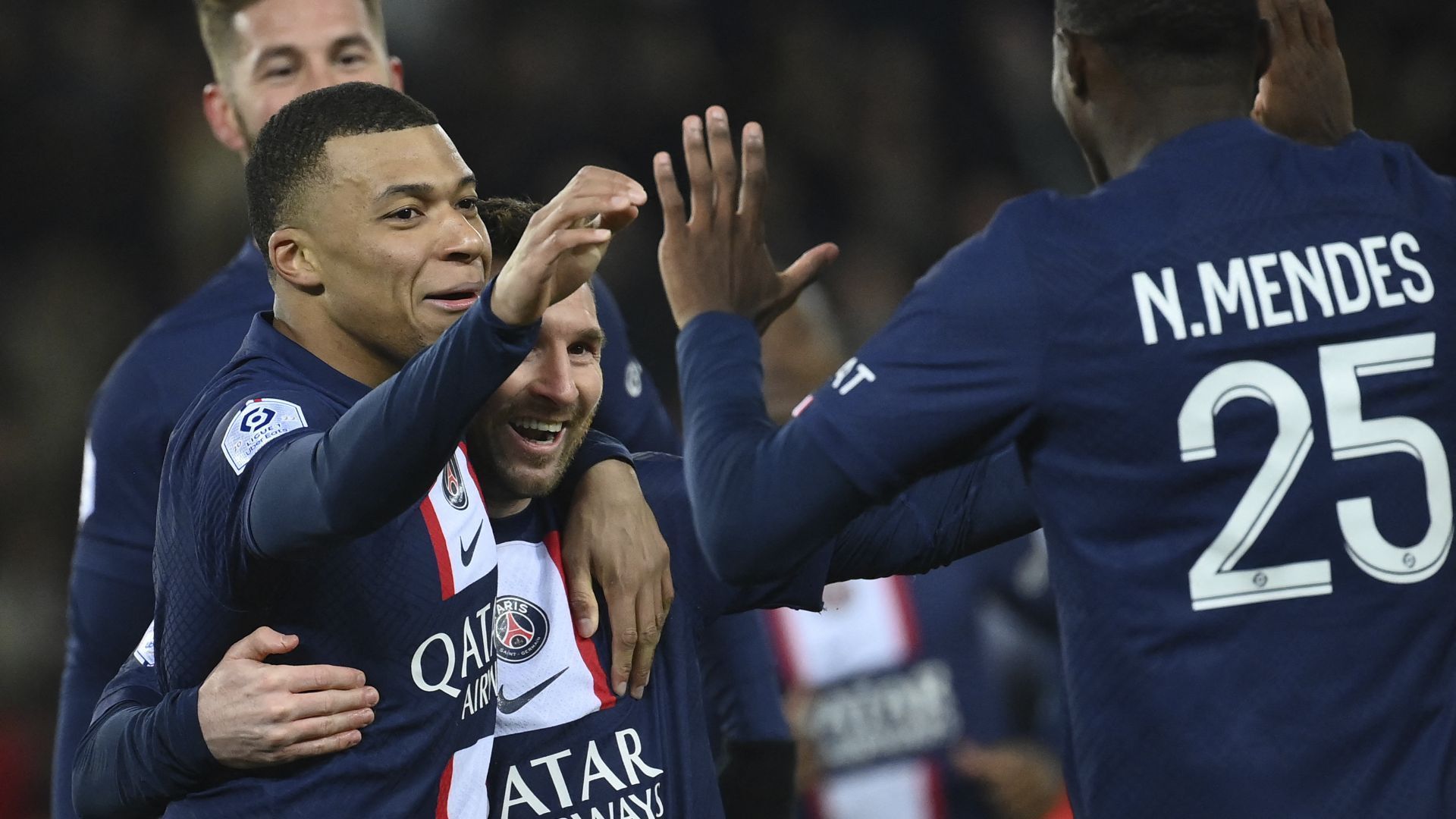 Kylian Mbappe celebrates a goal with Lionel Messi and other teammates