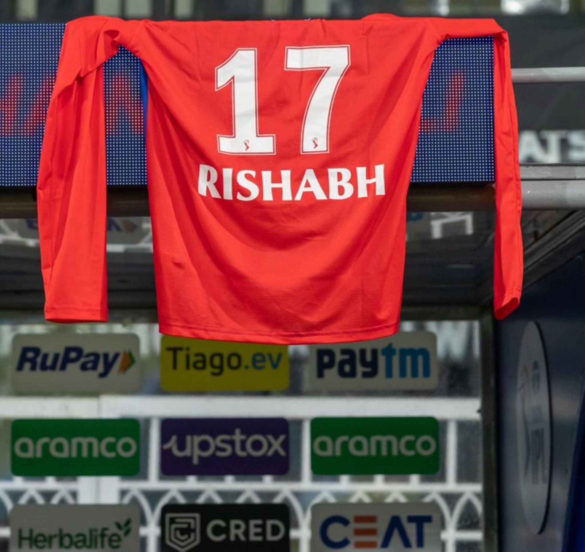 Rishabh Pant&#039;s jersey hangs above the Delhi Capitals dugout during their opening match.