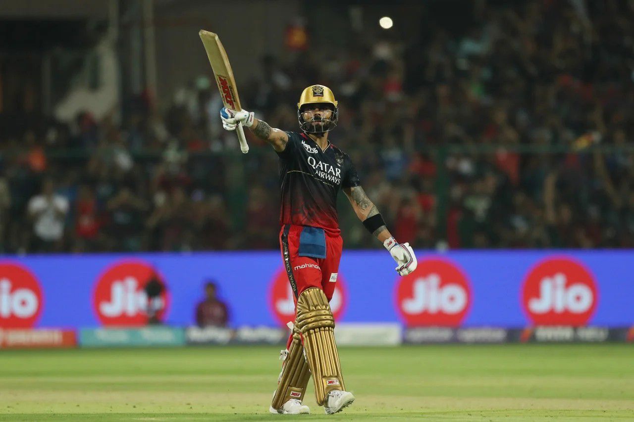 Virat Kohli raising his bat after a fifty vs MI [IPLT20]