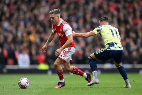 Leandro Trossard (in red) in action during match against Leeds United