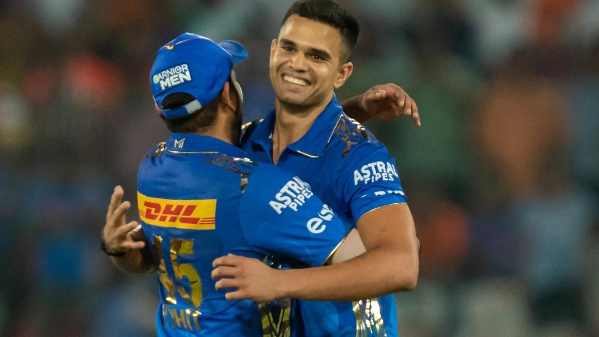 Arjun Tendulkar celebrating his maiden IPL wicket and MI