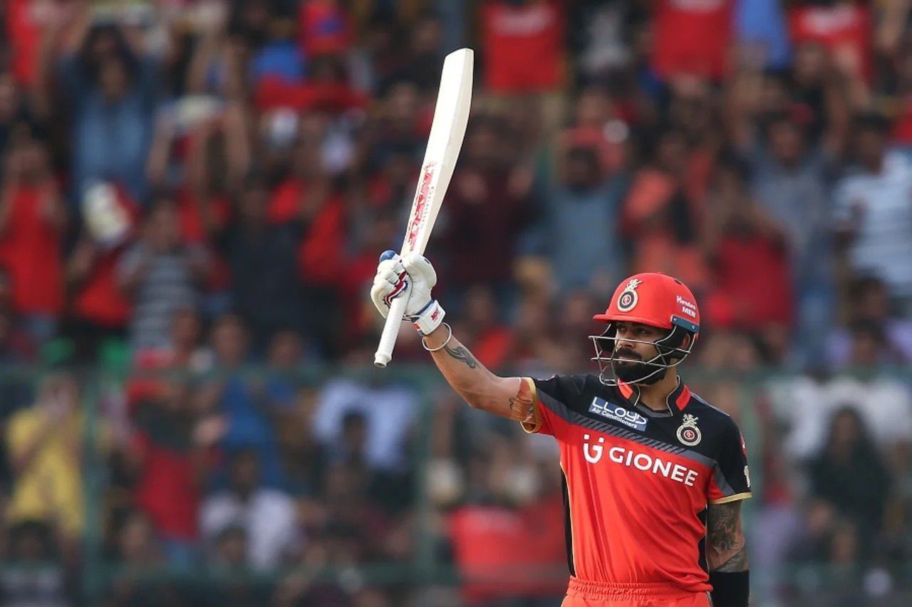 Virat Kohli raises his bat after a fifty vs MI [IPLT20]