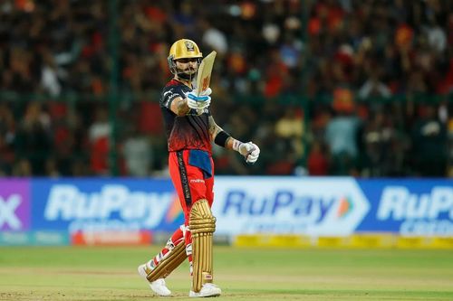 Virat Kohli raises his bat after scoring a fifty vs LSG [IPLT20]