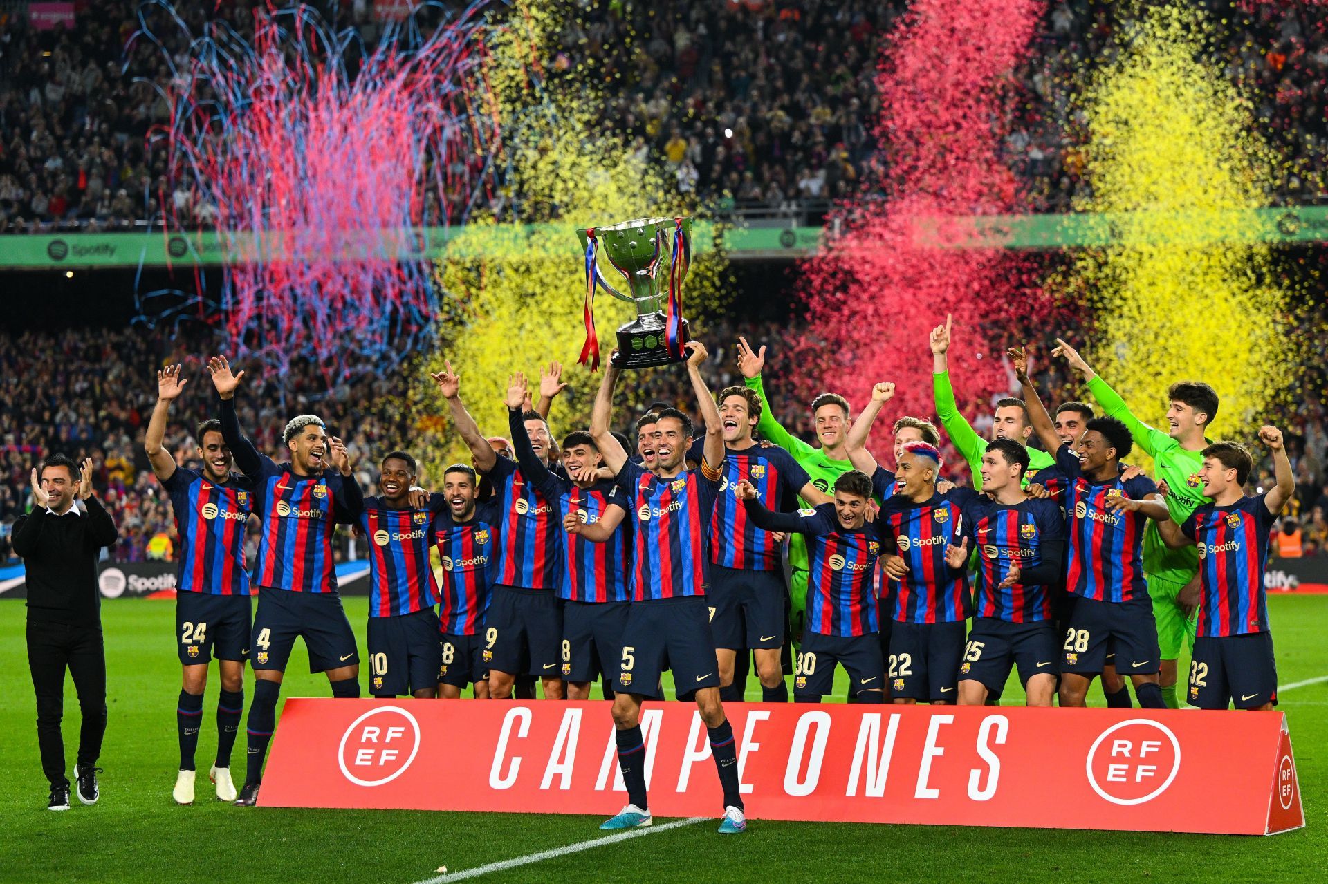 Barcelona captain Sergio Busquets, who will retire at the end of the season, lifts the La Liga trophy.