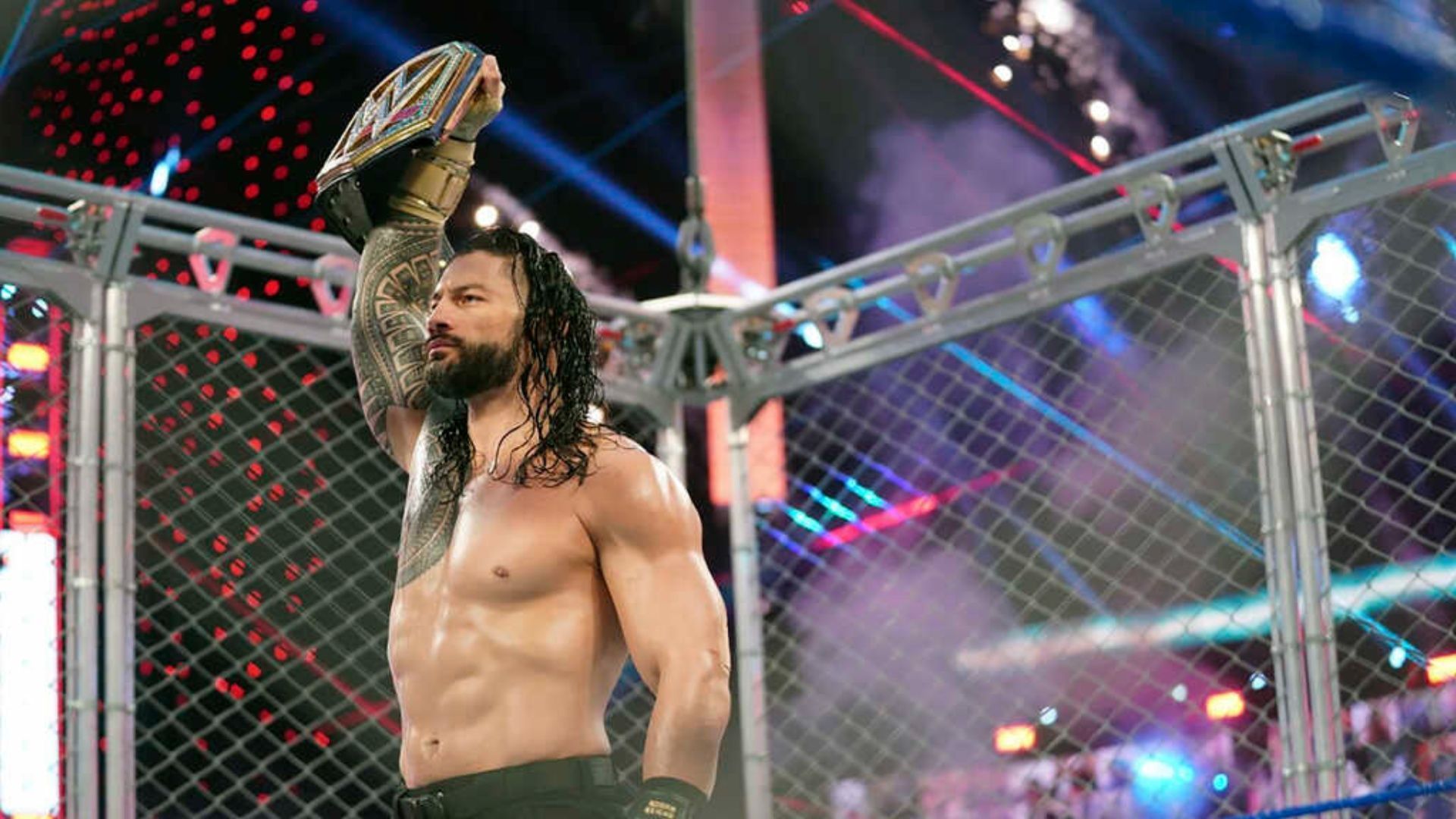 Roman Reigns poses with the Universal Championship.