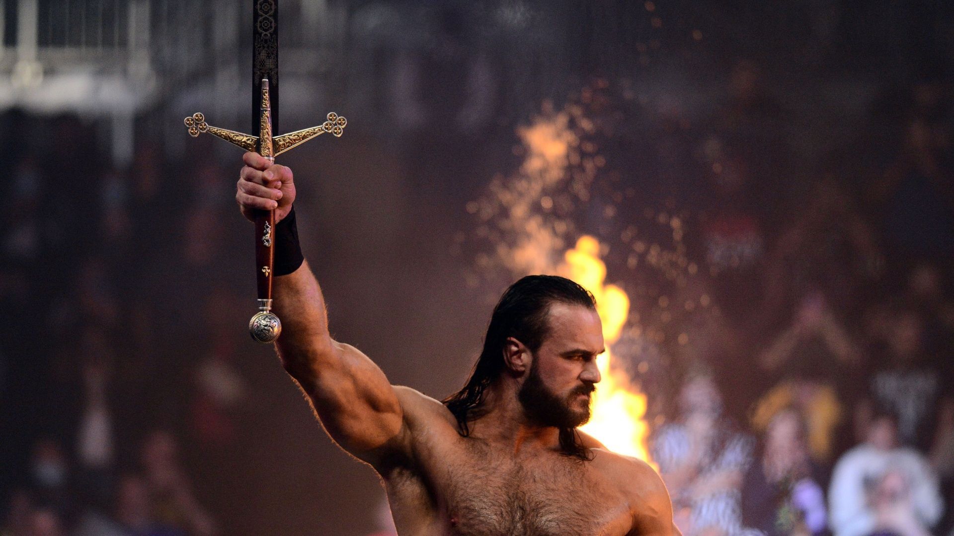 Drew McIntyre poses with his sword Angela.