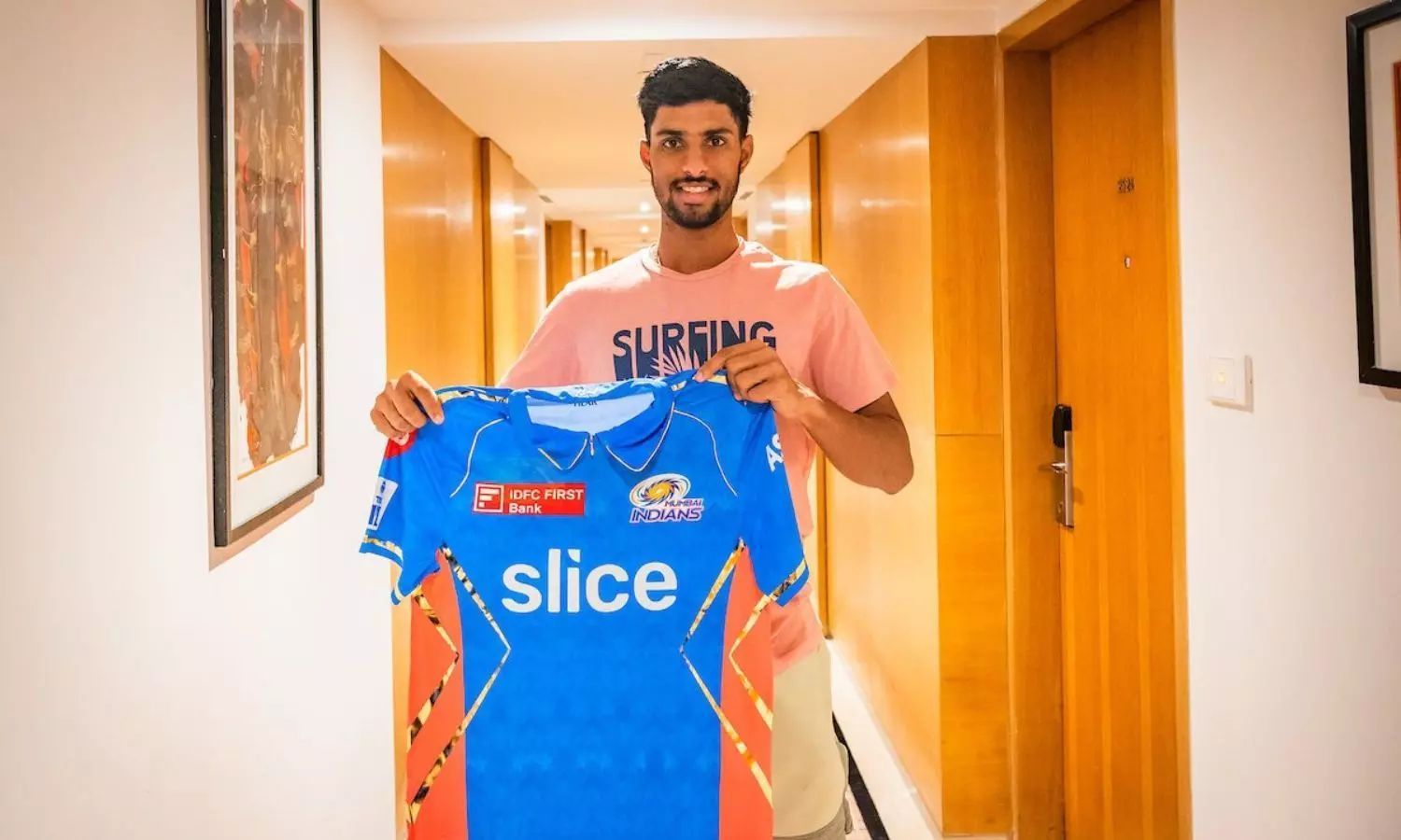 Tilak Verma posing with MI's lavender jersey ahead of their game against KKR