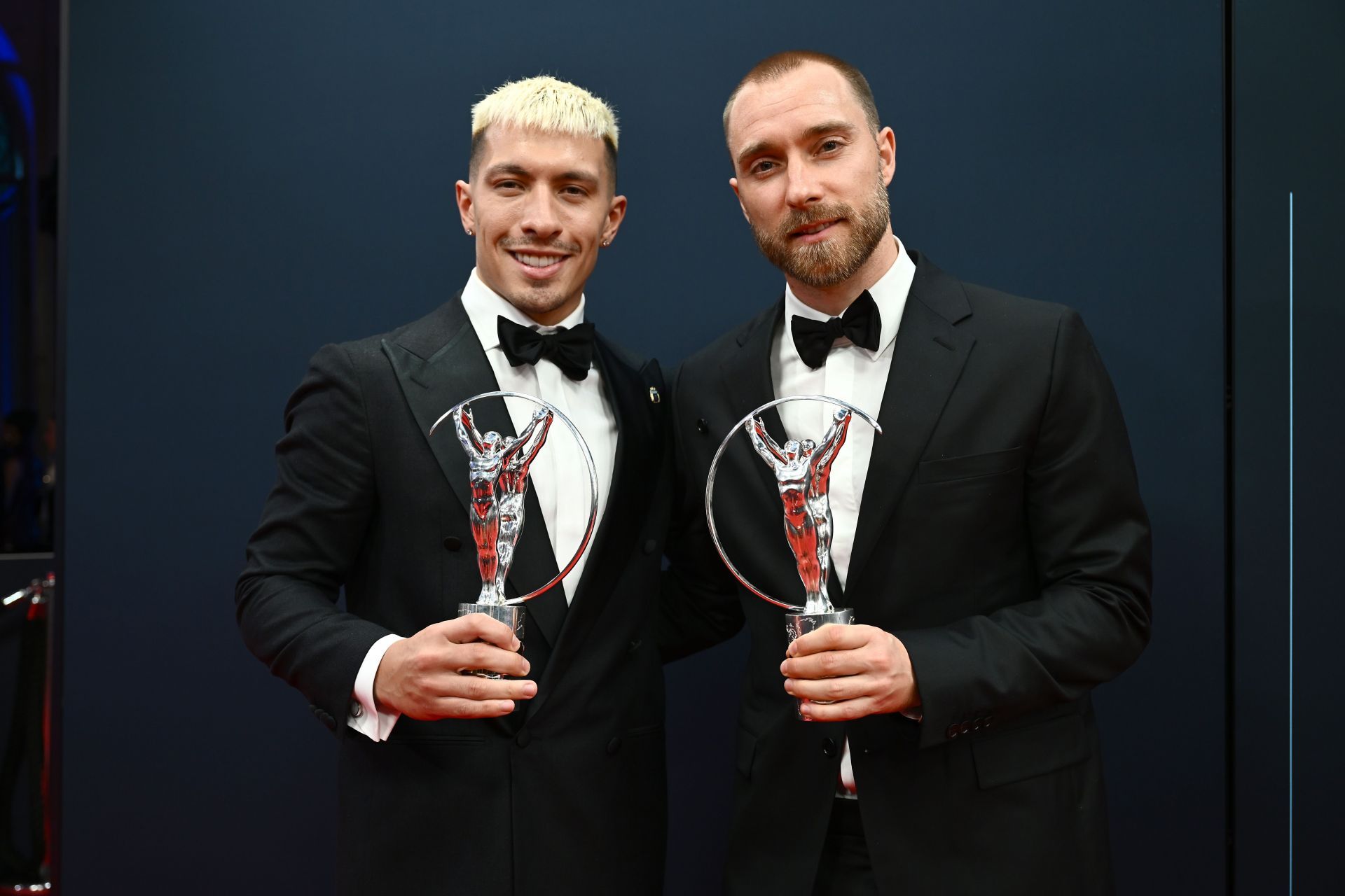 Lisandro Martinez (left) and Christian Eriksen picked up awards.