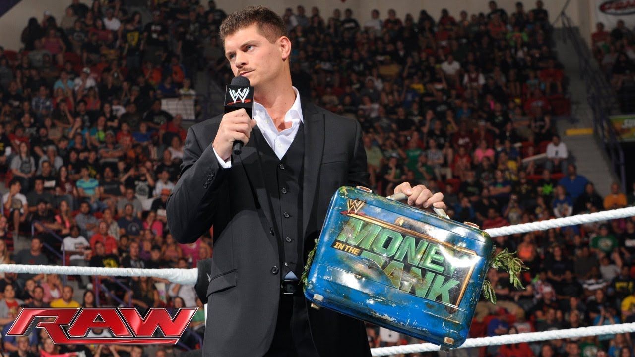 Cody Rhodes holding the briefcase during his feud with Damien Sandow in 2013