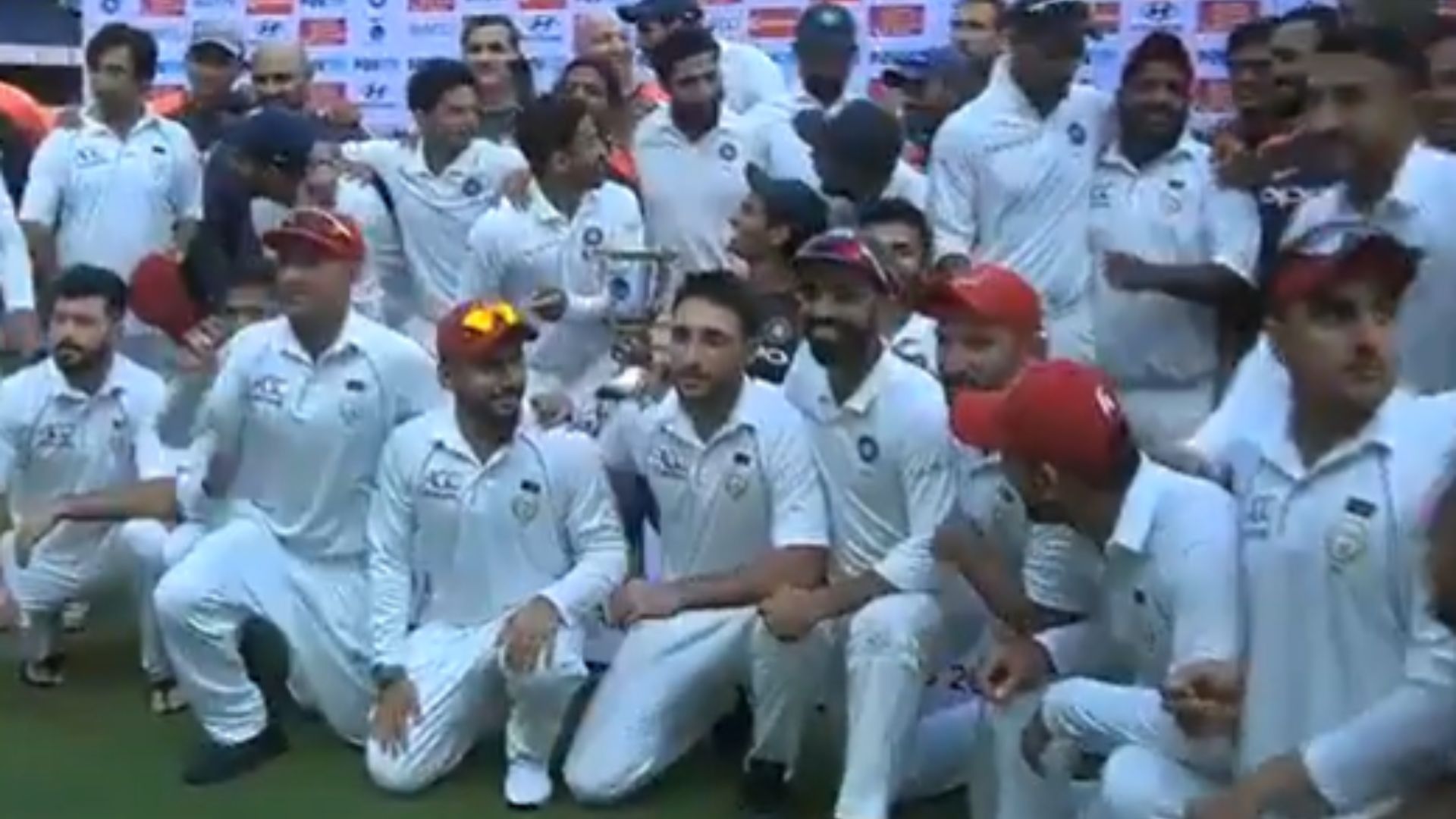 Ajinkya Rahane invited Afghanistan players to take a group photo with the trophy (P.C.:Twitter)