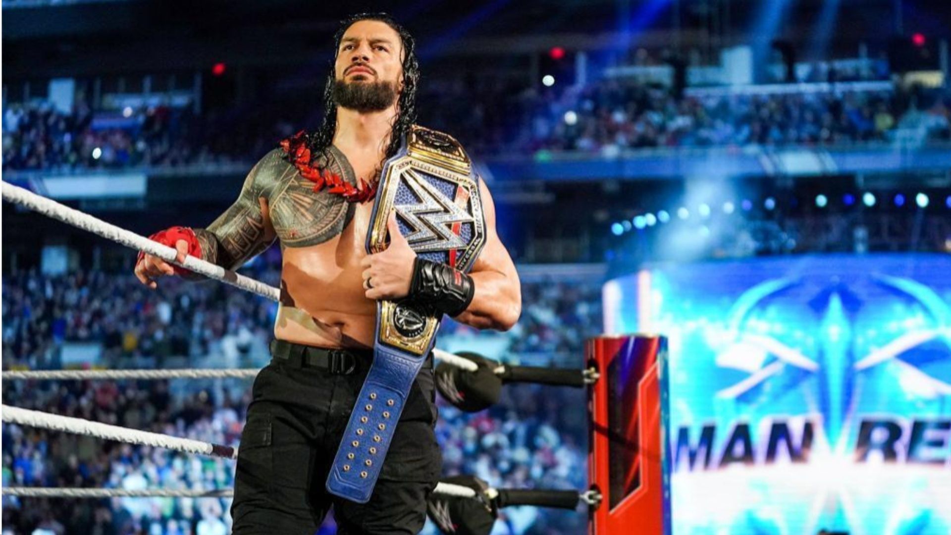 Roman Reigns enters the ring at a WWE event.