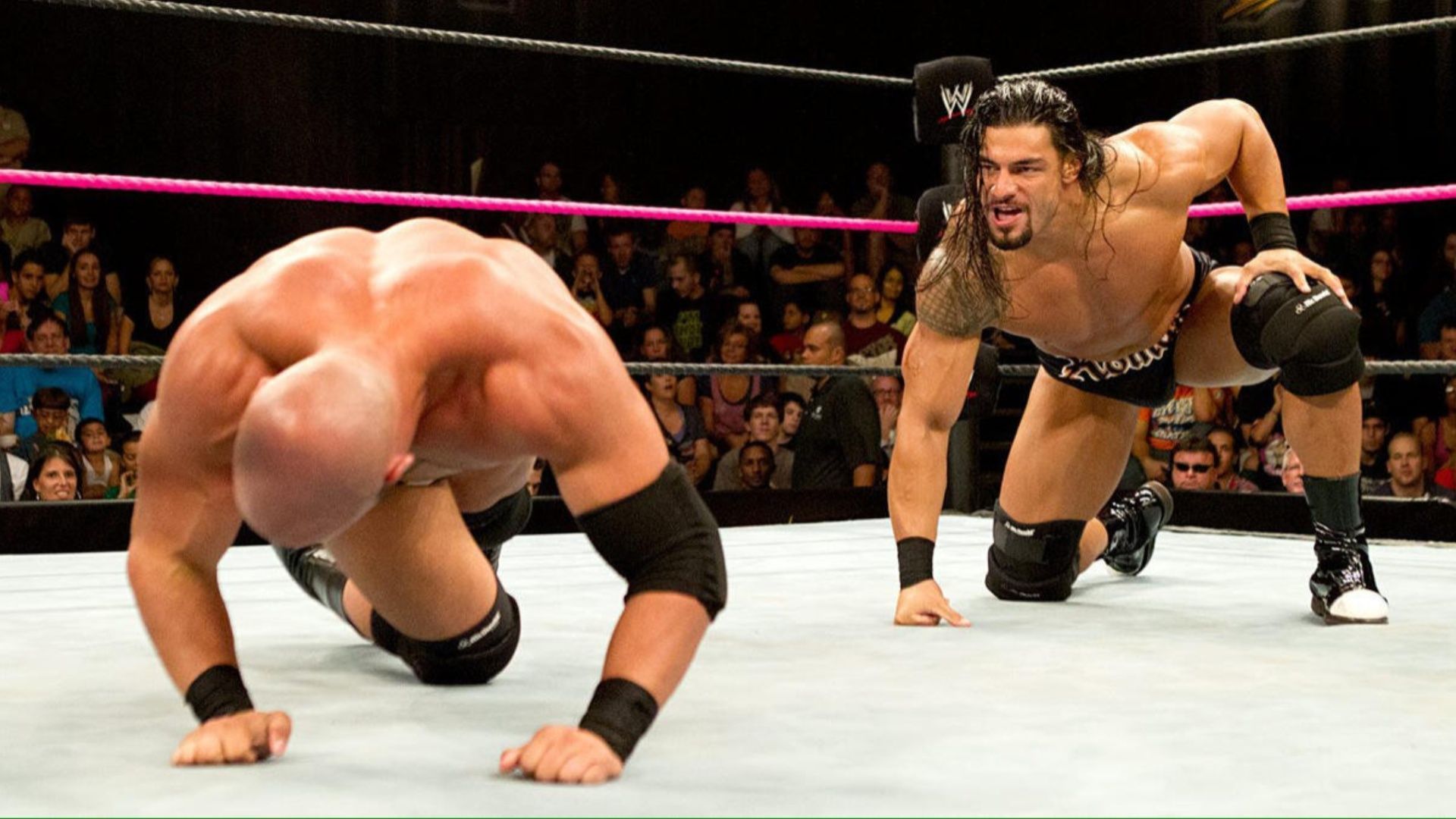 Roman Reigns taunts his opponent in NXT.