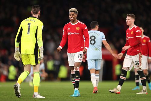 Rashford (centre) will replace De Gea as the club's highest earner.