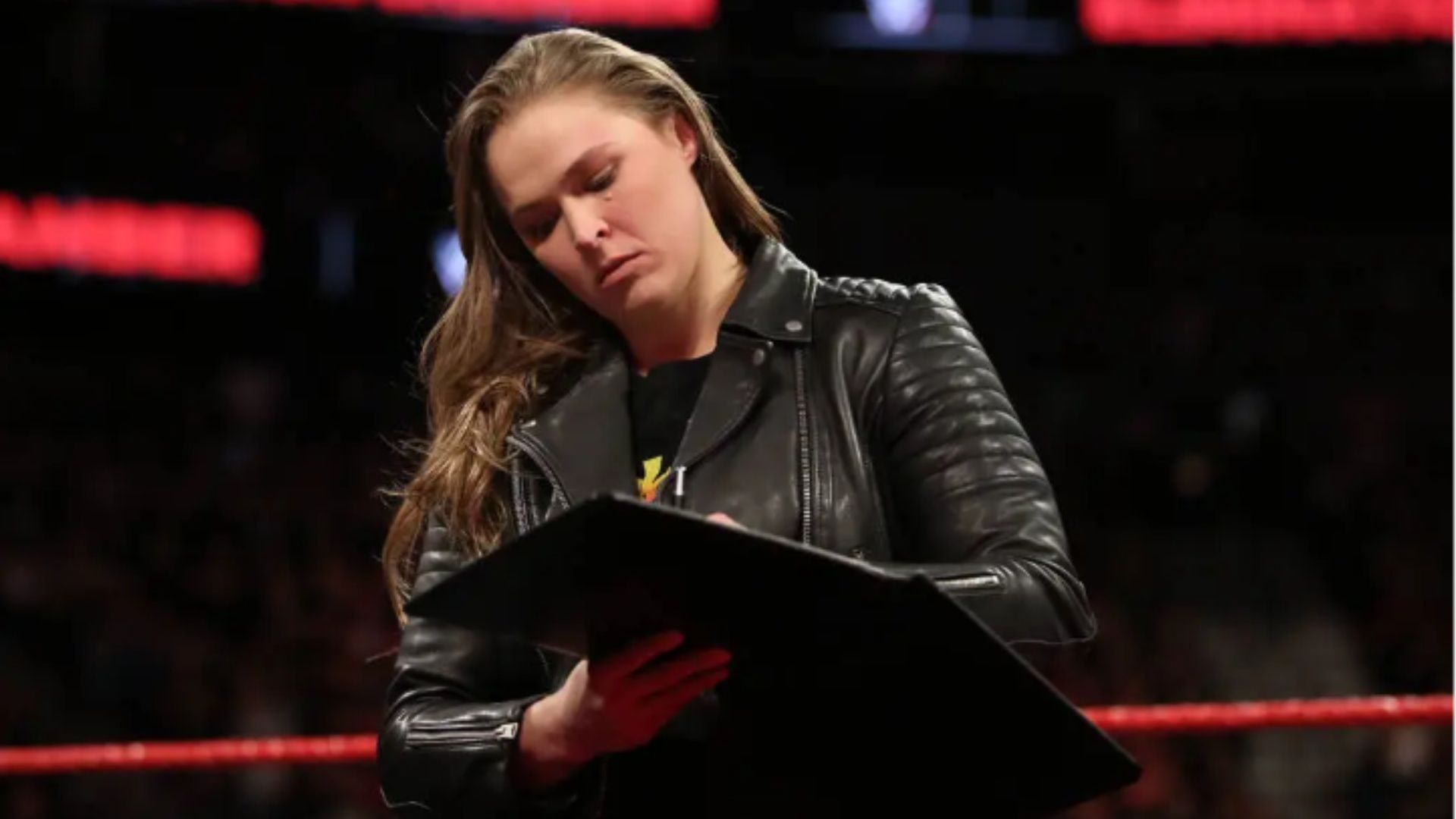 Ronda Rousey signed her WWE contract in a televised segment.