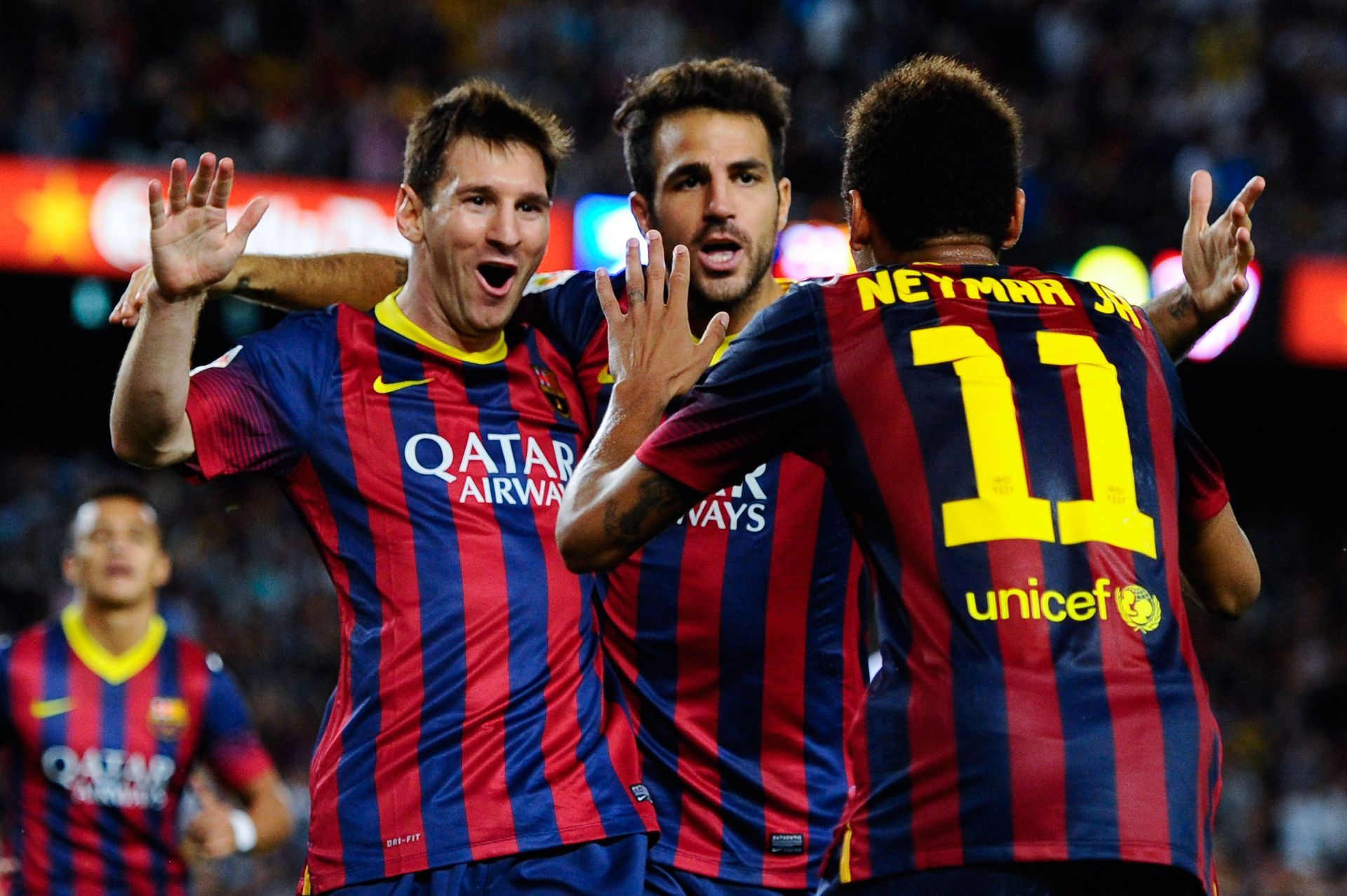 Fabregas (middle) wanted Lionel Messi (left) to return to Barcelona last summer.