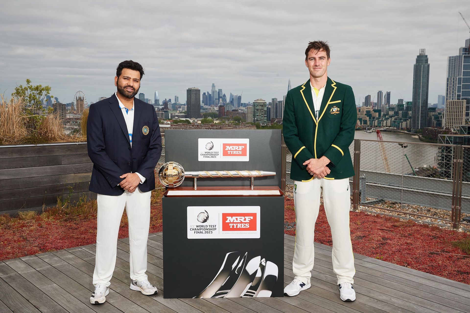 The captains Rohit Sharma (L) and Pat Cummins with the mace (P.C.:ICC)