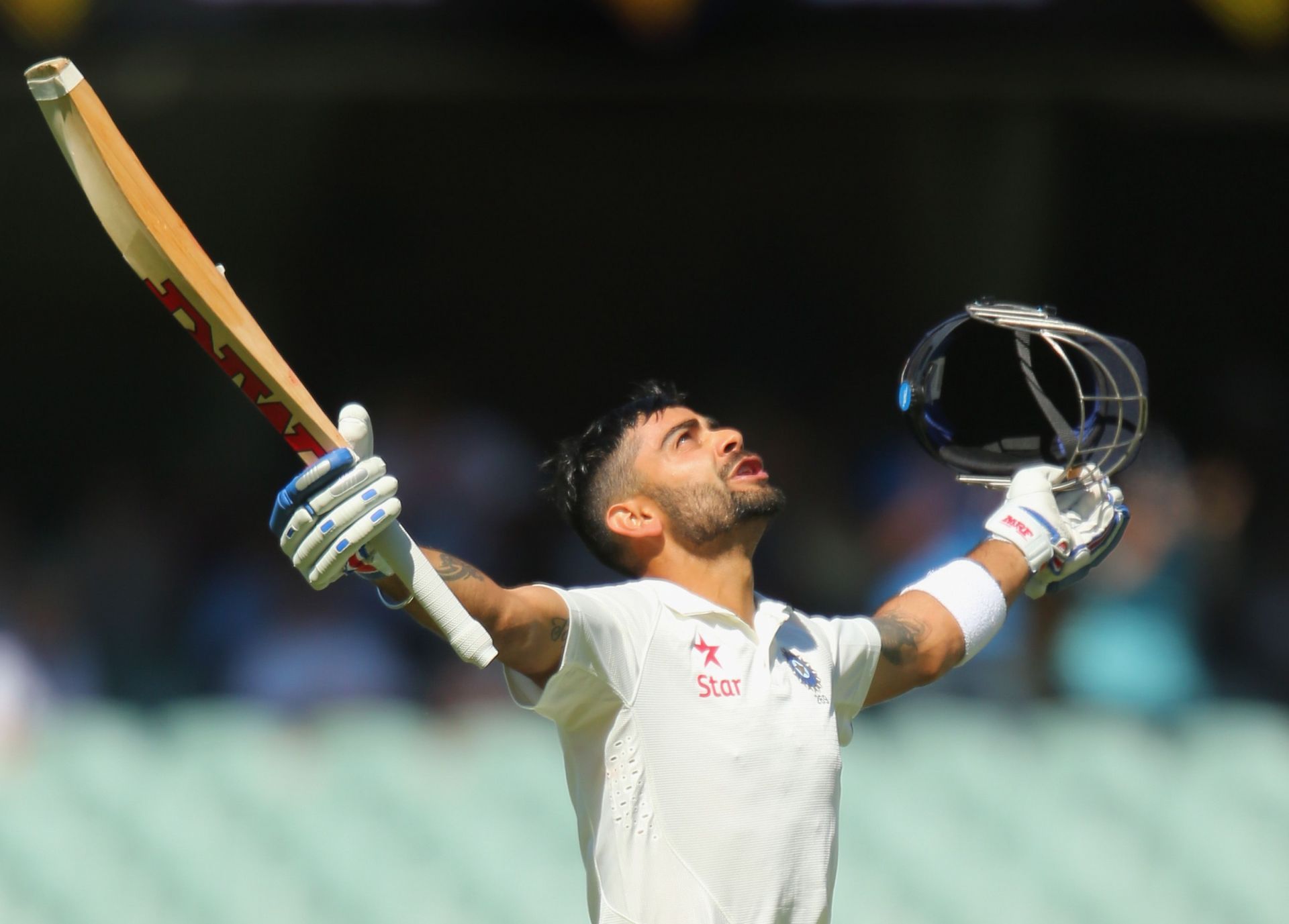 Virat Kohli celebrates his century on Day 5 of the Adelaide Test in 2014.