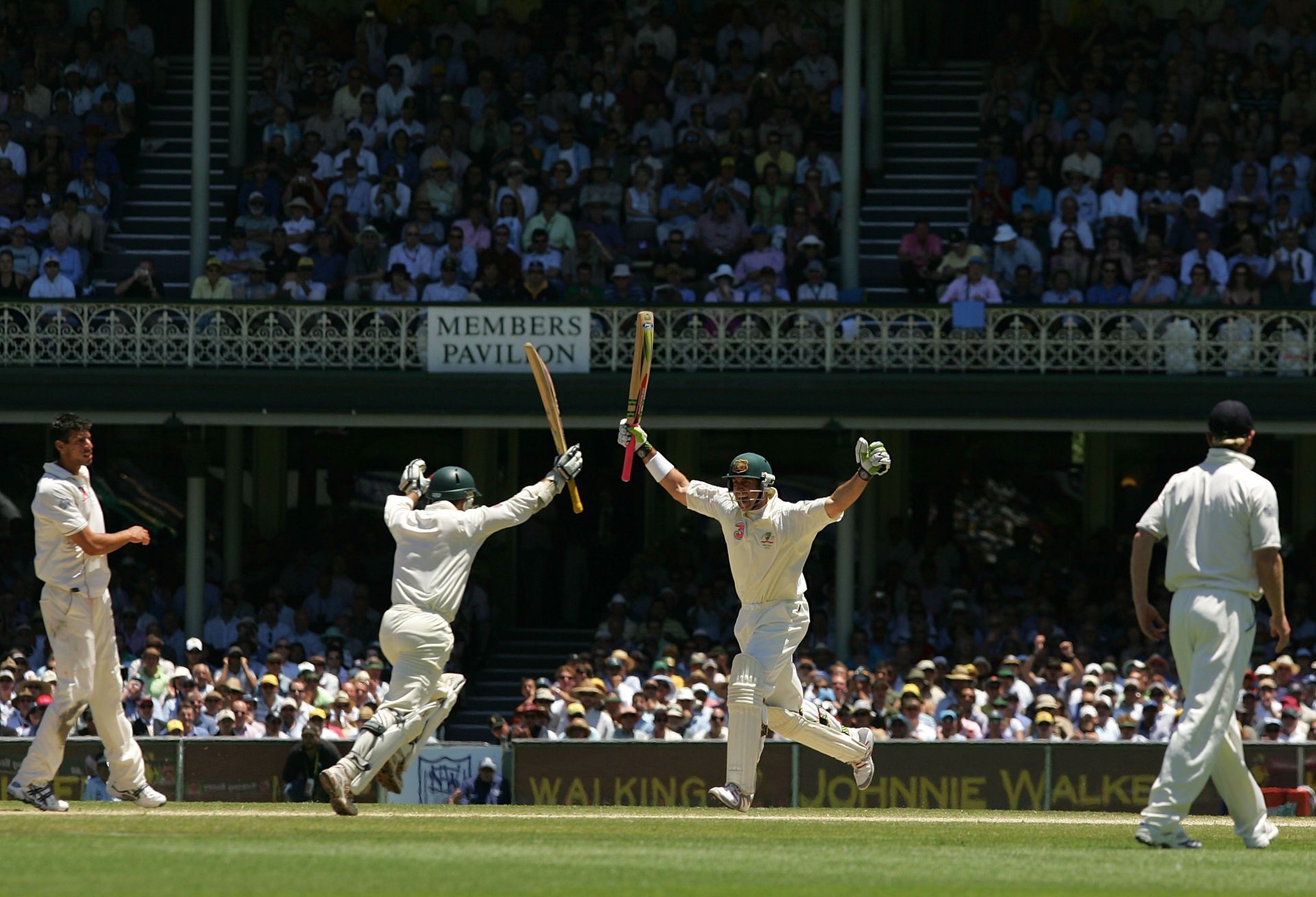 Justin Langer (left) and Matthew Hayden strike a similar pose after lifting Australia to victory in the 2006-07 Ashes Test in Sydney. (Pic: Getty Images)