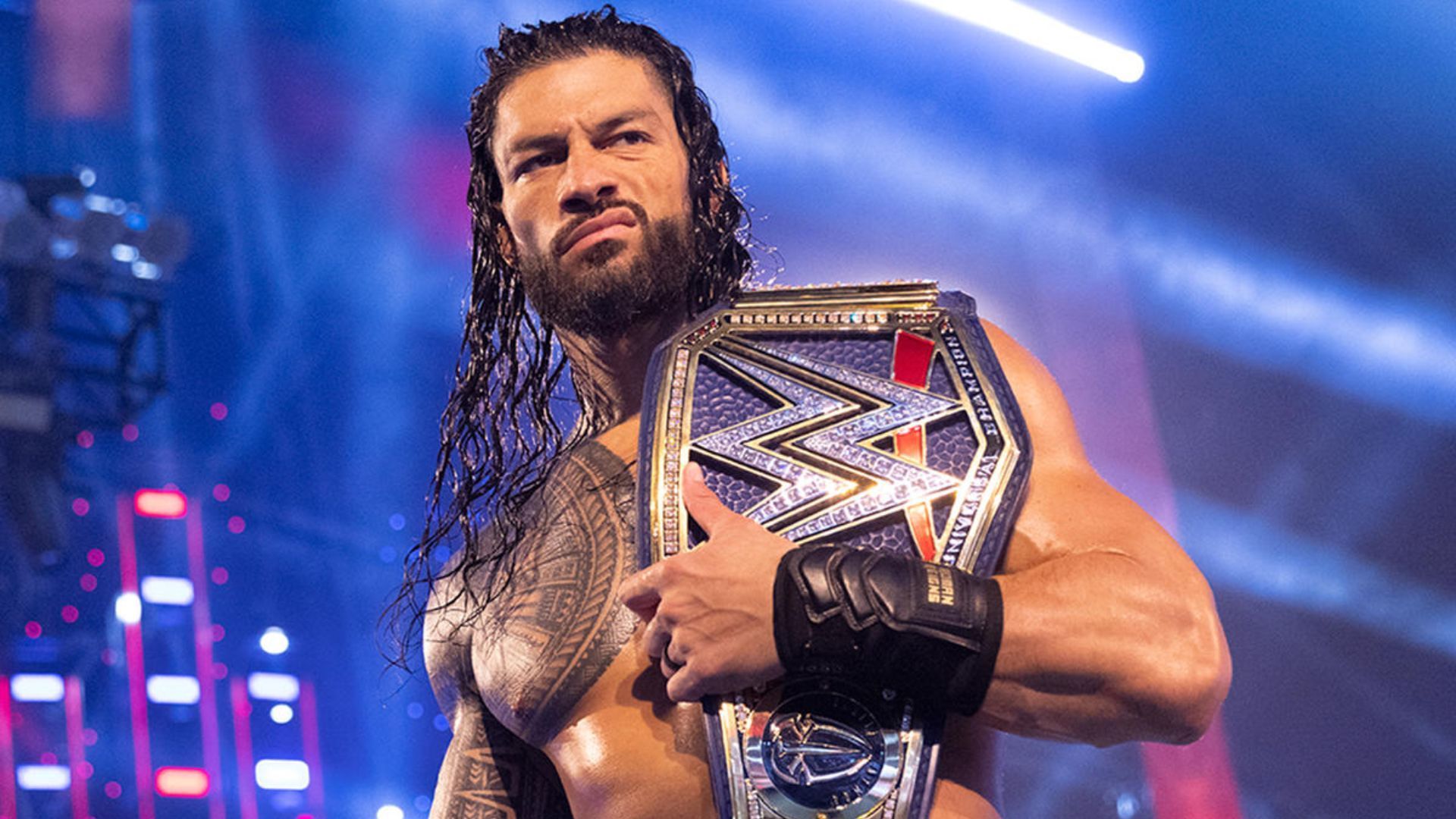 Roman Reigns with his title. Image Credits: wwe.com