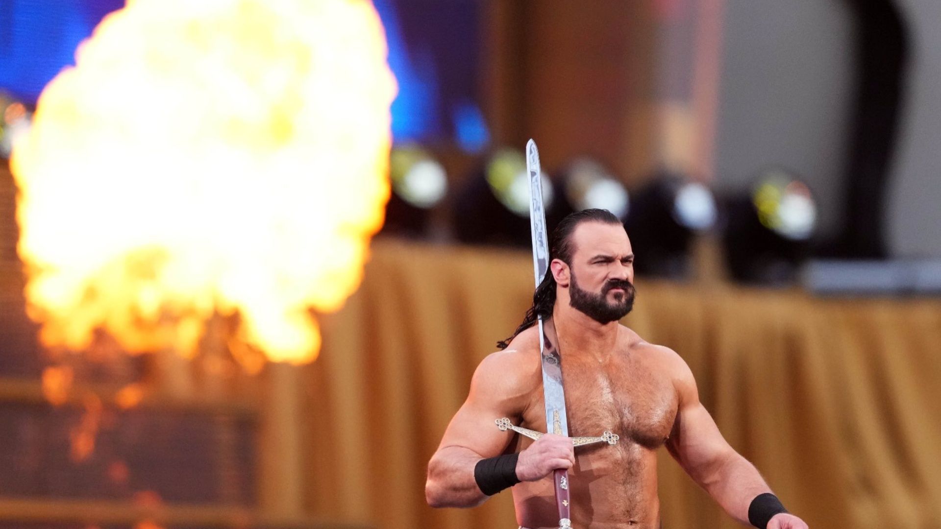 Drew McIntyre carries his sword 