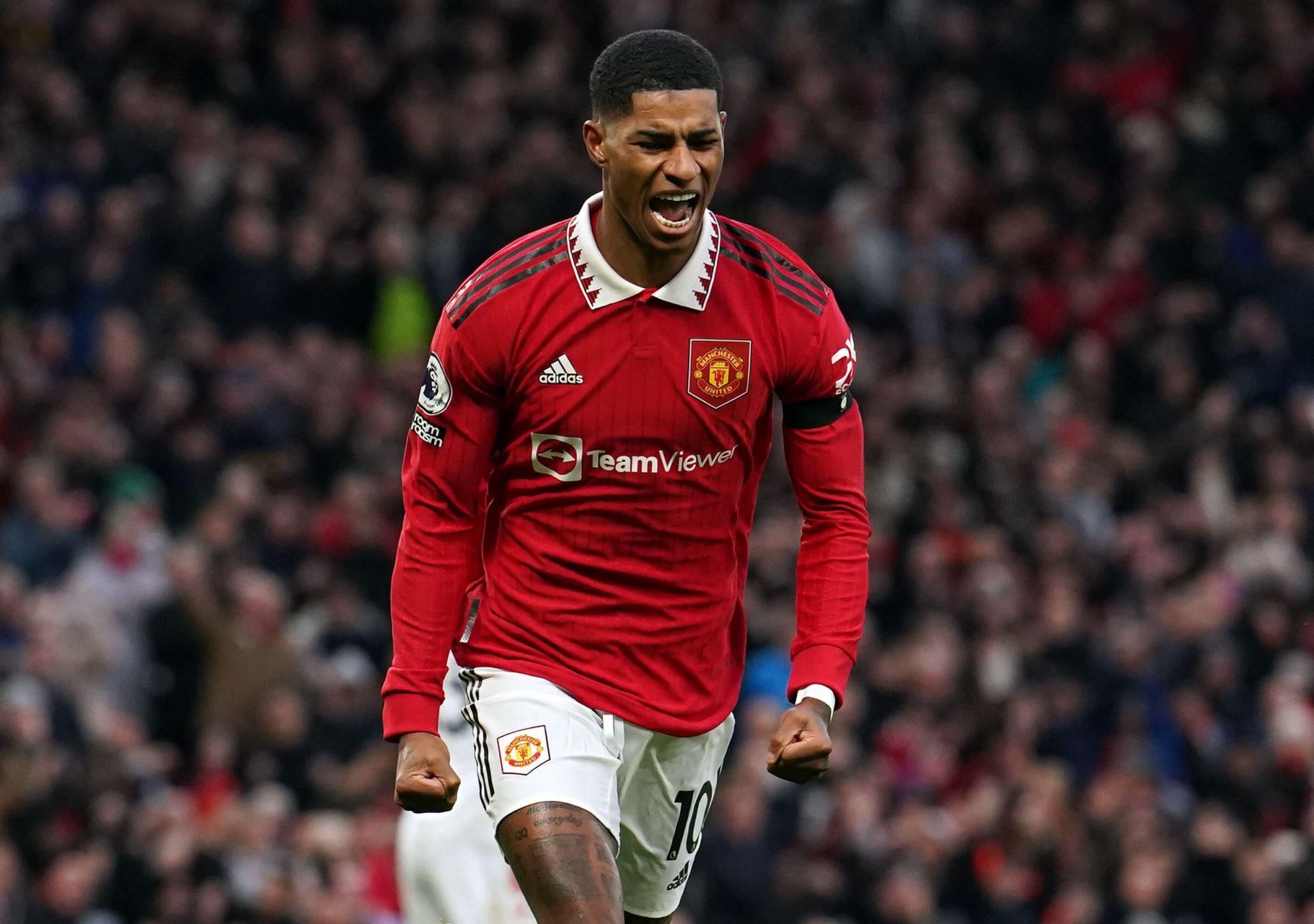 Marcus Rashford celebrates after scoring a goal for Manchester United.