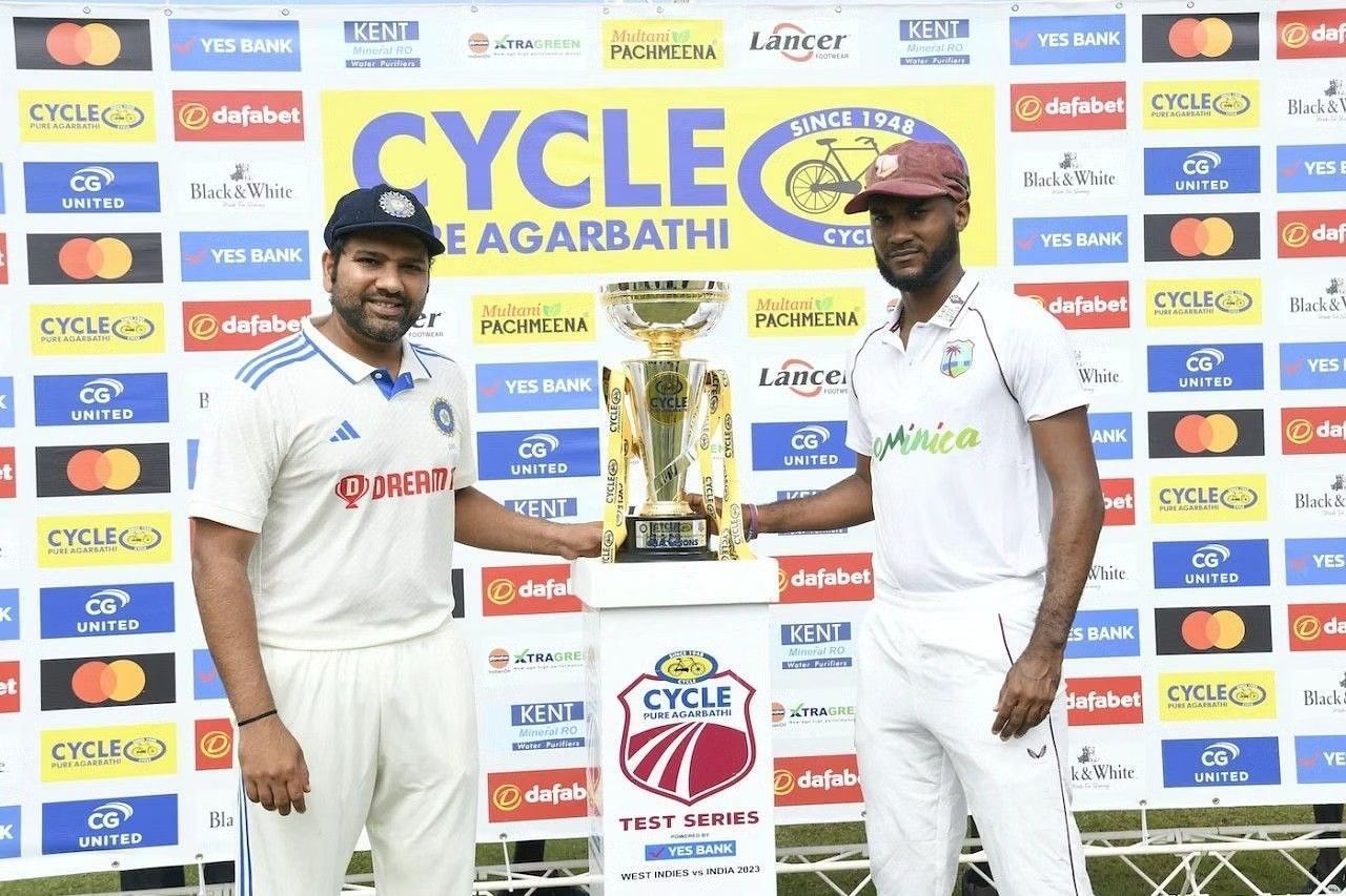 Rohit Sharma and Kraigg Braithwaite with the trophy [Getty Images]