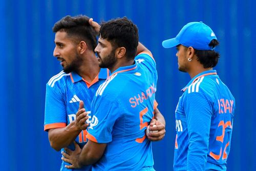 Umran Malik [left] has bowled three overs in each of the two games thus far