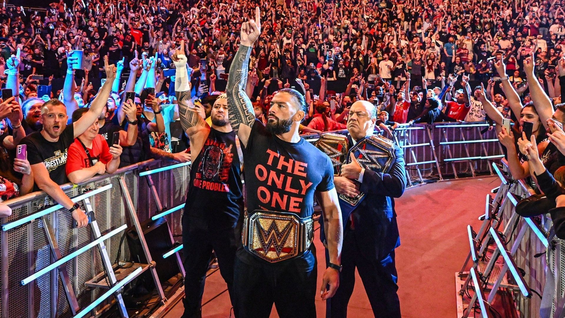 Roman Reigns, Solo Sikoa and Paul Heyman at a WWE event.