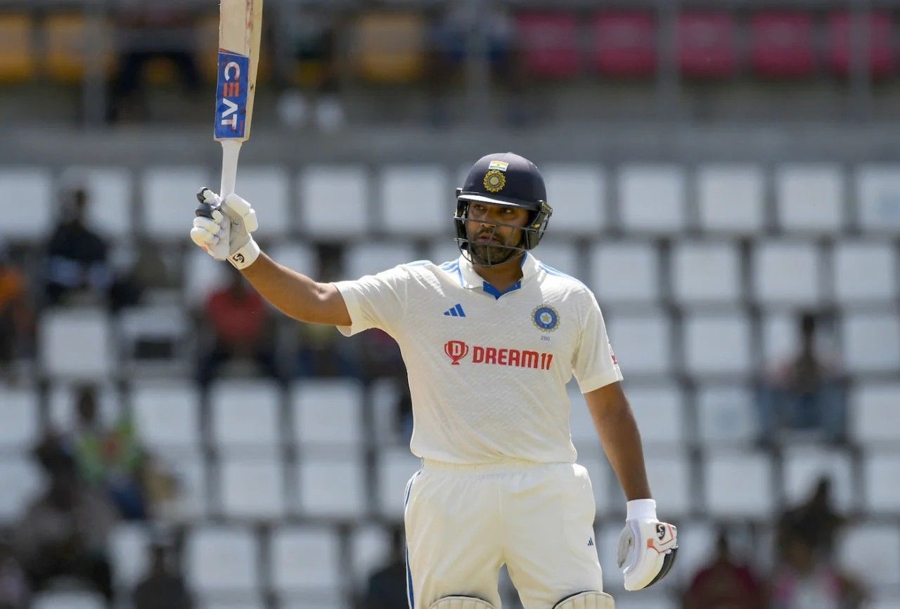 Rohit Sharma raises his bat after a fifty [Getty Images]
