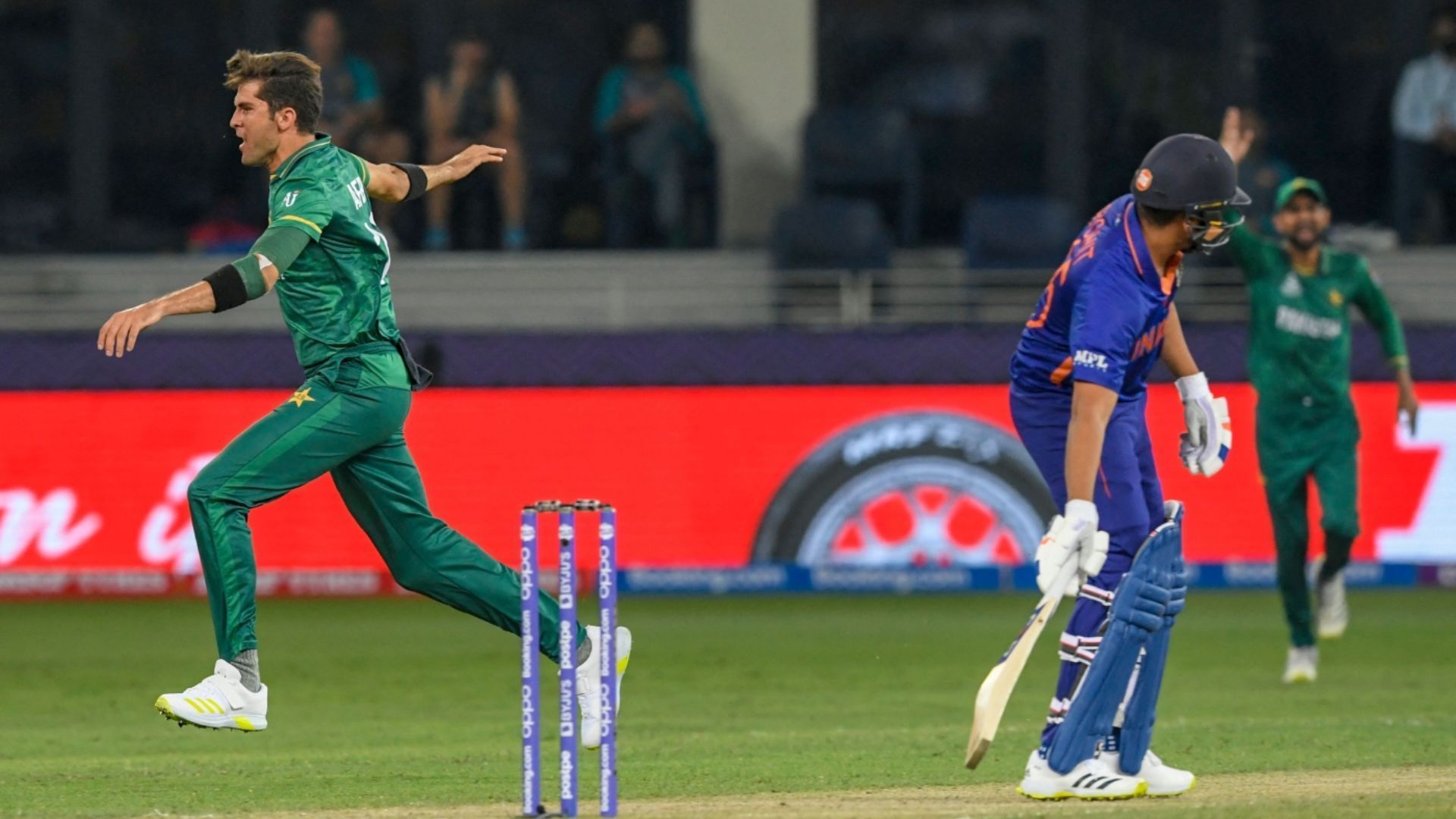 Shaheen Afridi celebrates after dismissing Rohit Sharma (R) during T20 World Cup 2021 (P.C.:X)