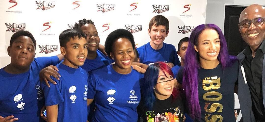 Asuka with Sasha Banks and fans