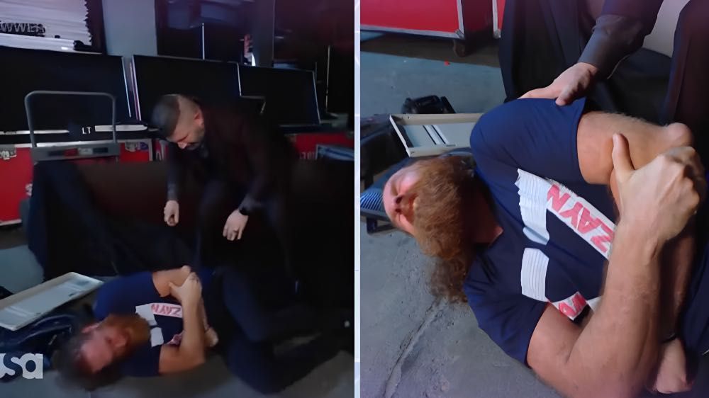 Sami Zayn in pain after being attacked 