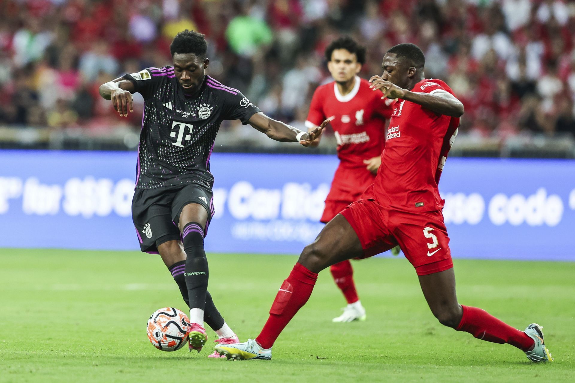 Alphonso Davies (left) has admirers at the Santiago Bernabeu.