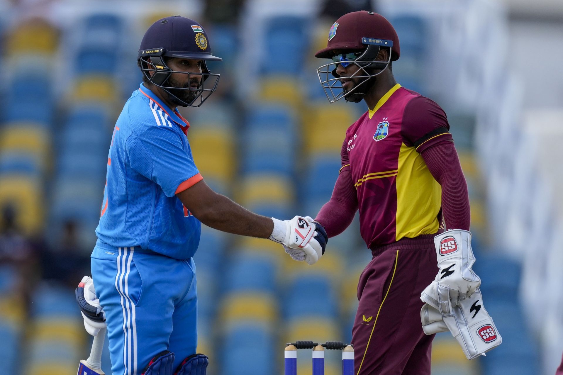 The Indian skipper shakes hands with West Indies' captain Shai Hope (right). (Pic: AP Photo/Ricardo Mazalan)