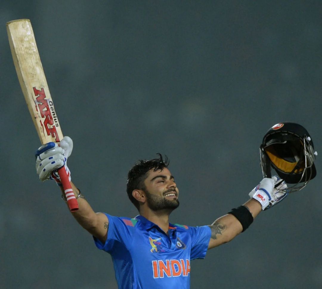 Virat Kohli raising his arms after a hundred vs Bangladesh [Getty Images]